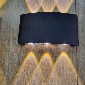 Wall-Bracket with separate light sources that shine both upward and downward